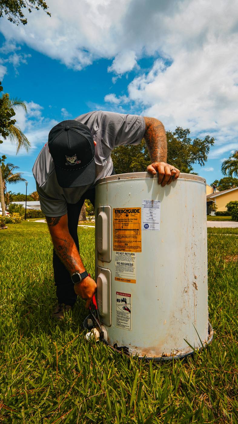 Clearview Plumbing & Gas inspecting a residential water heater in Palm Beach County
