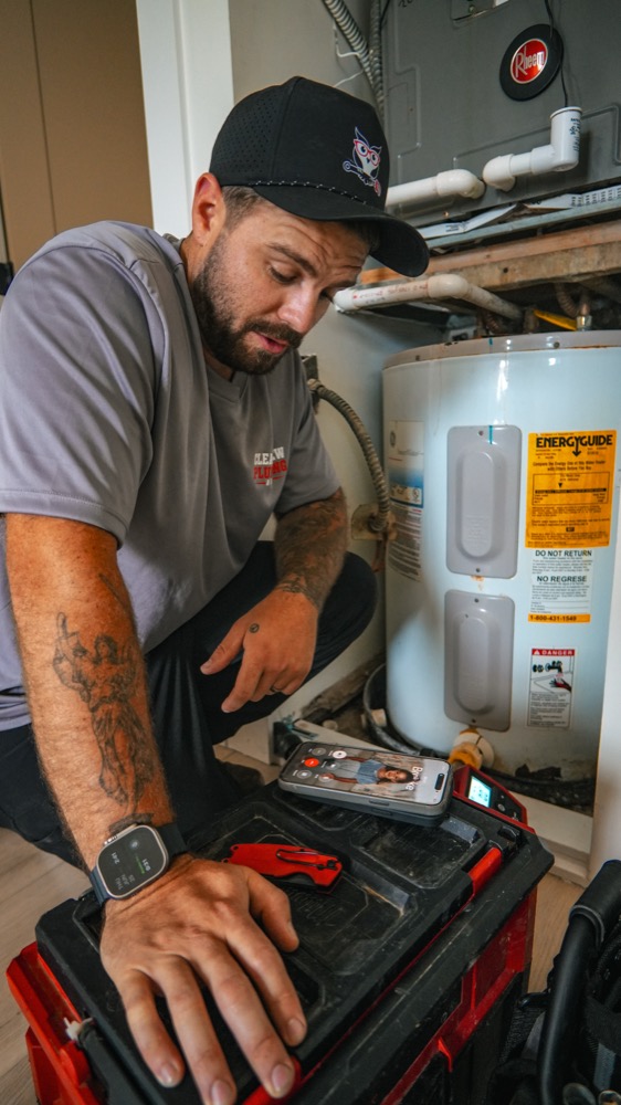 Clearview Plumbing & Gas technician repairing a water heater in a Delray Beach home