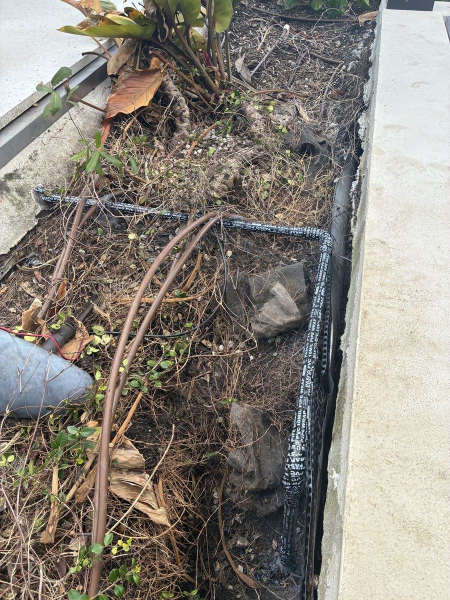 Underground gas line trenched through a landscape bed by Clearview Plumbing & Gas