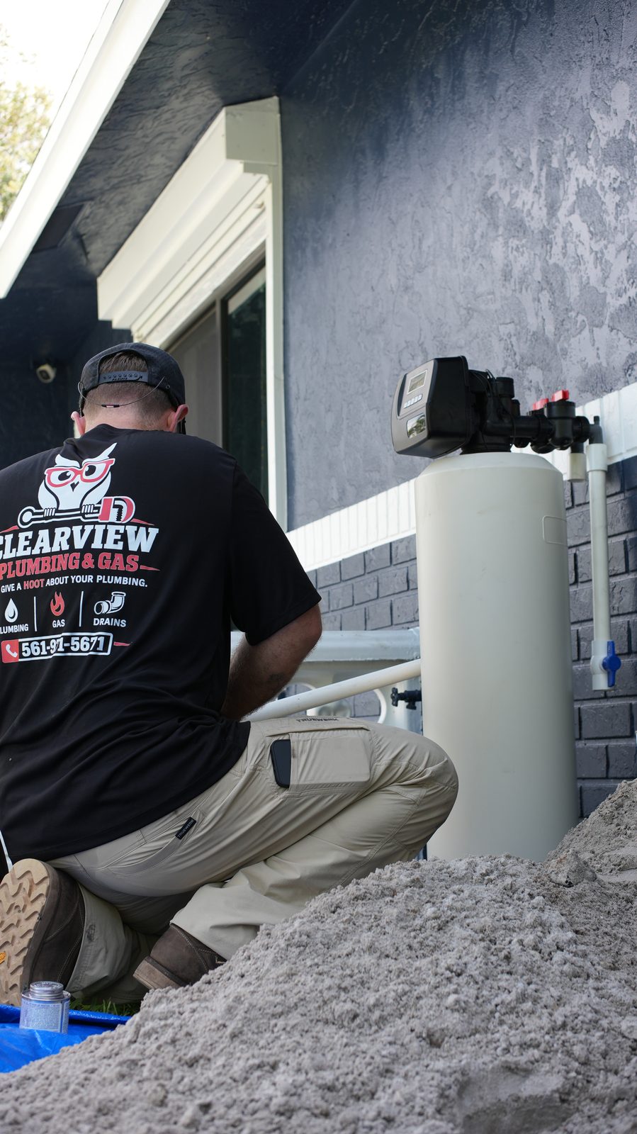 Clearview technician connecting a water filtration system